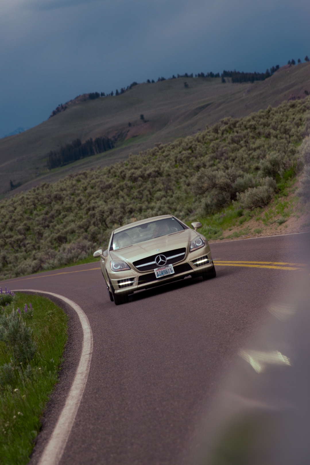 Mercedes SLK350 on mountain road in storm