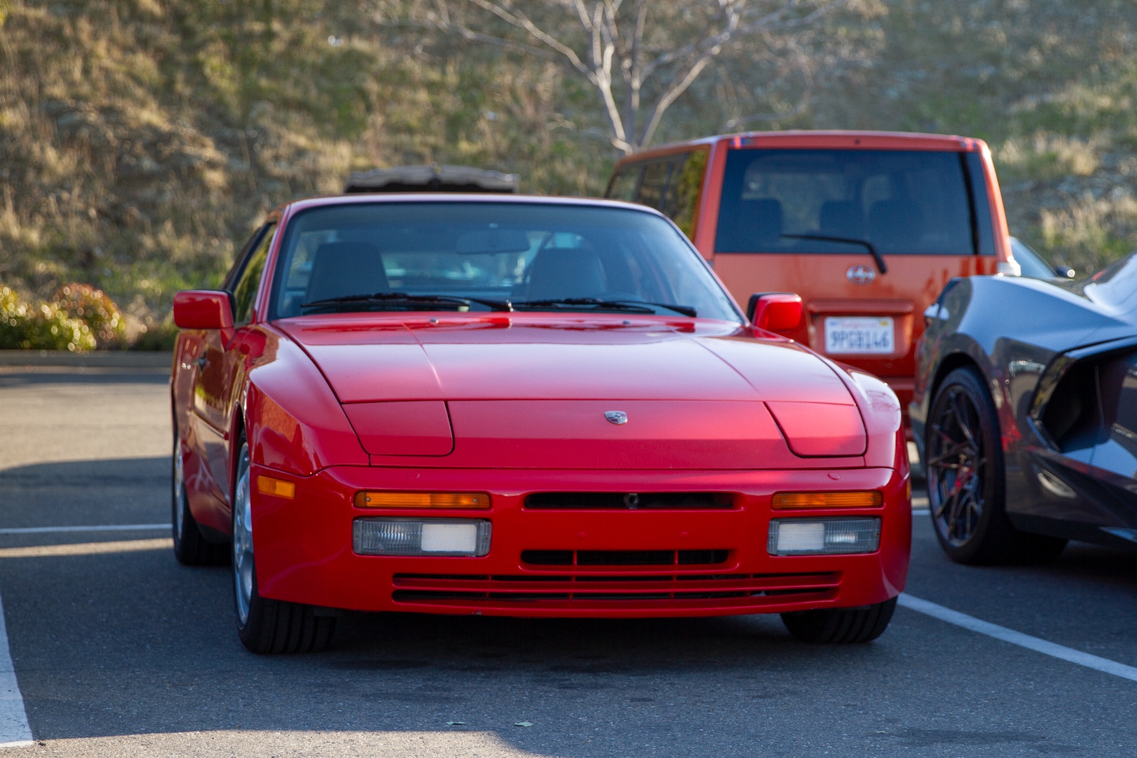 Red Porsche 944 Turbo front at car meet