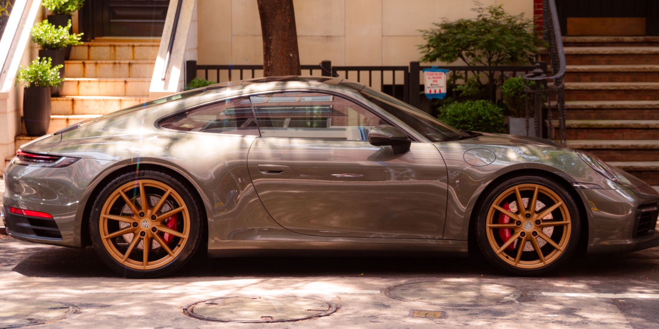 Slate grey Porsche 992 911 on urban street