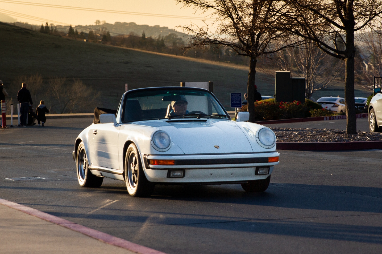 Porsche 911 Carrera convertible at golden hour