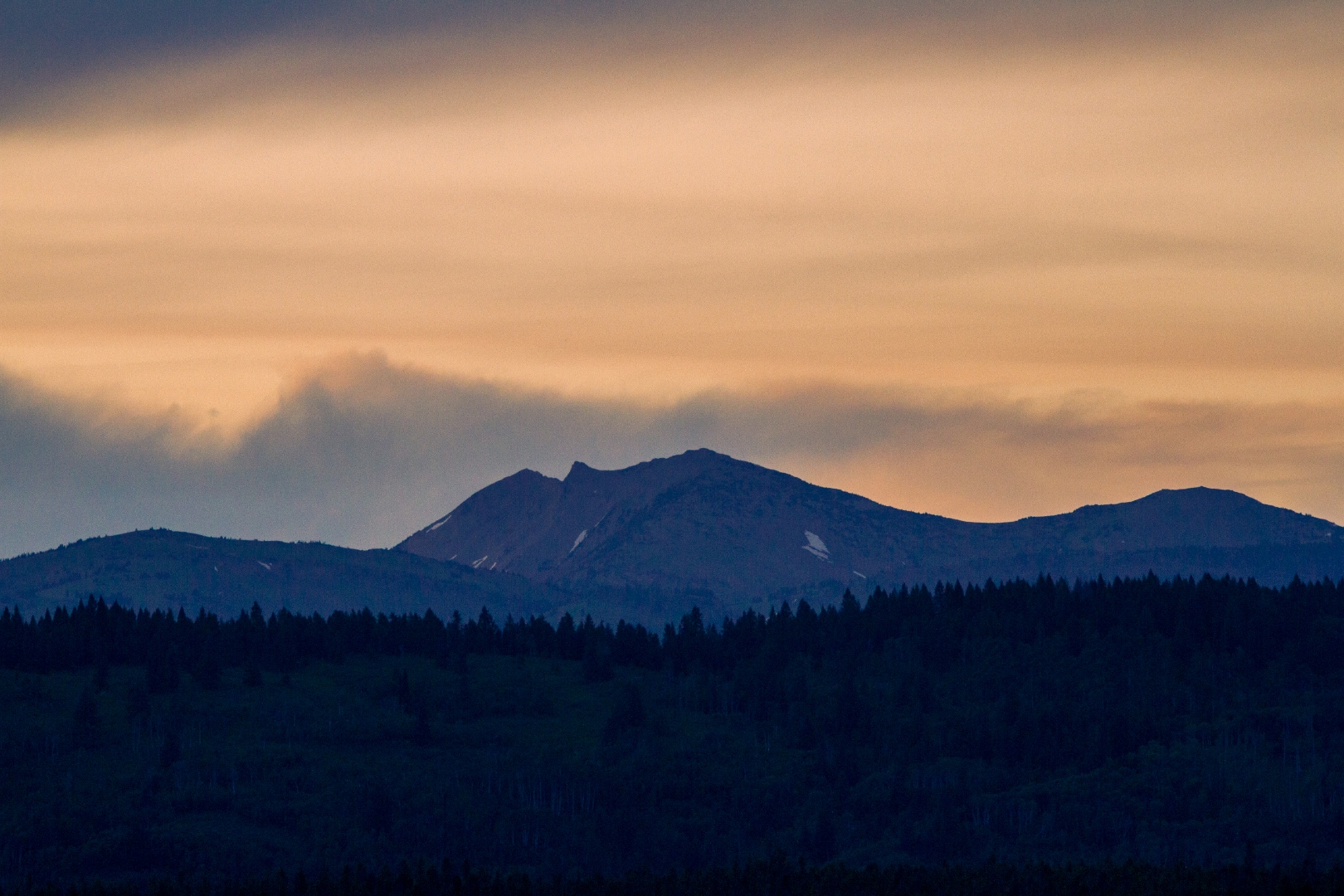 Sierra Nevada peaks at dusk with blue-orange sky