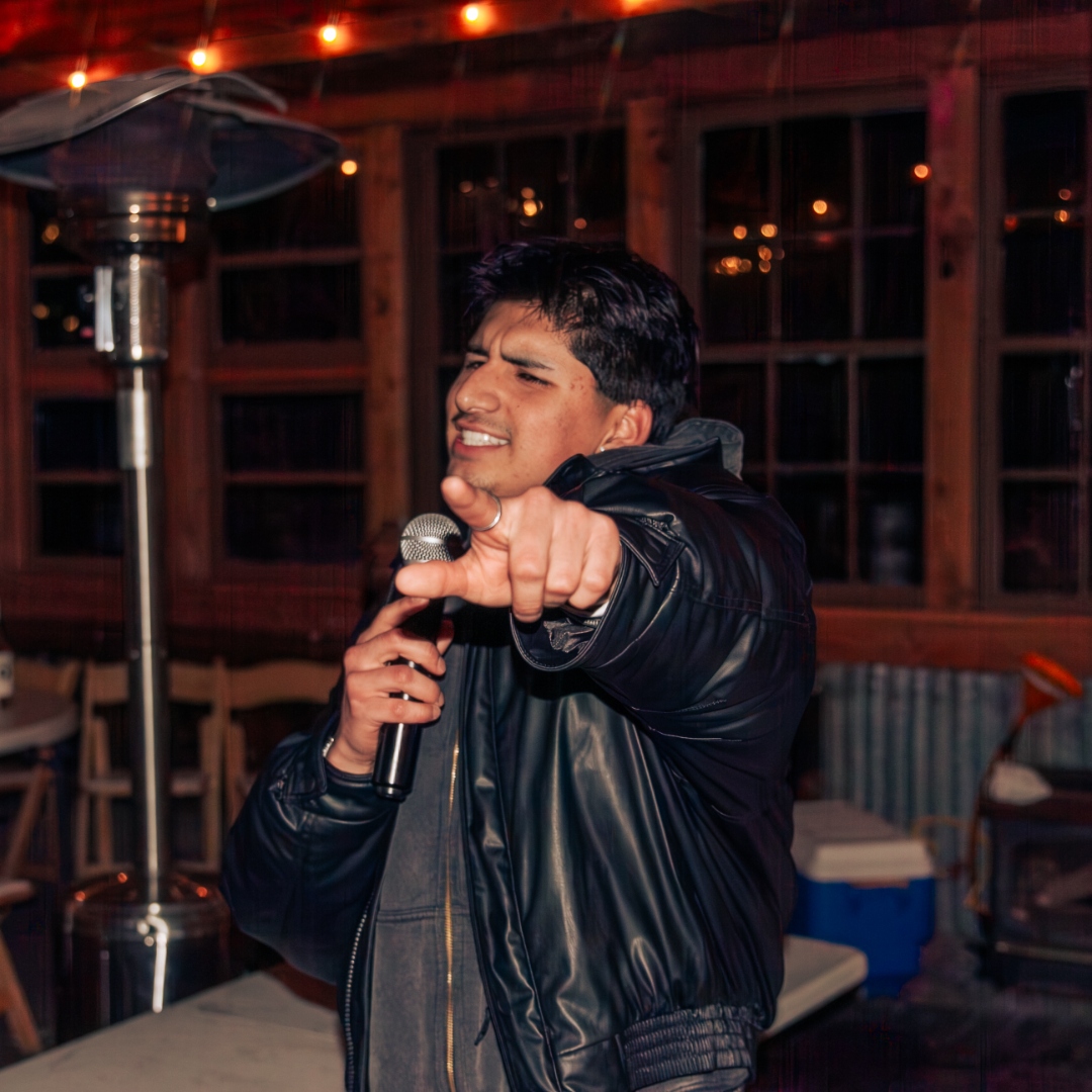 Friend at karaoke with microphone pointing at camera