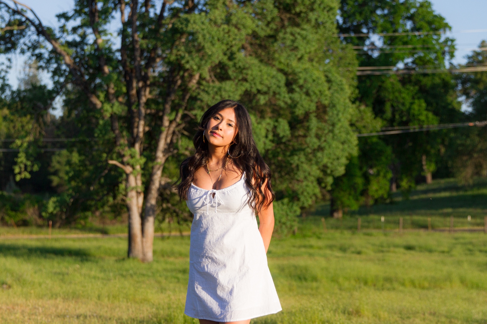 Woman in white dress, wider shot