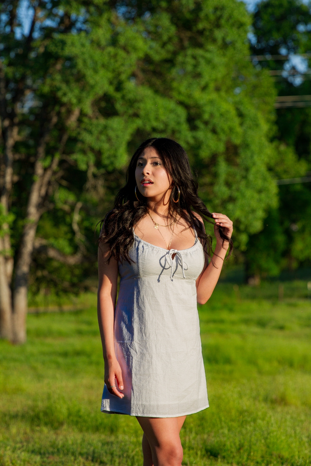 Woman in silver dress, golden hour