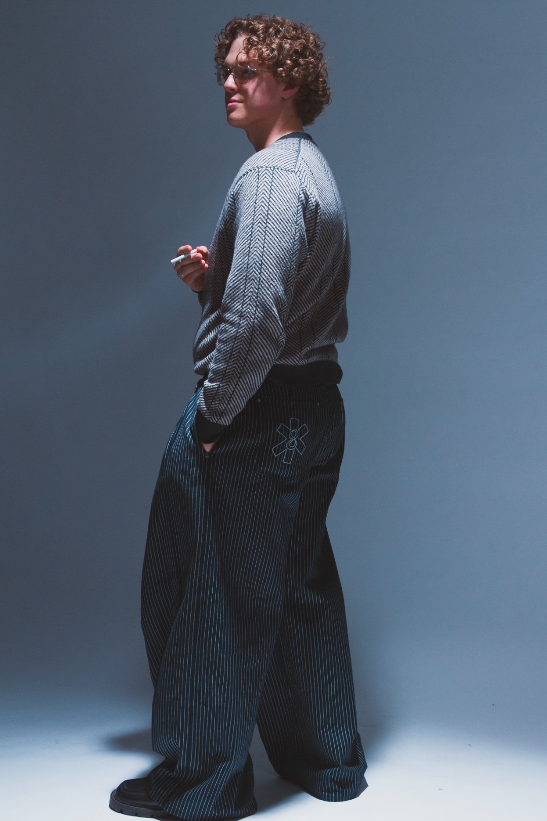 Self-portrait: side profile looking back over shoulder